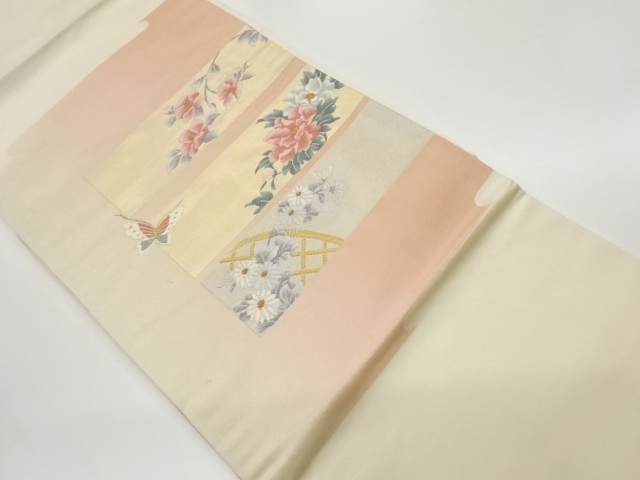 ヱ霞に色紙・蝶・花葉模様織出し名古屋帯